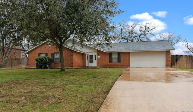 ranch-style home featuring a garage, brick siding, fence, driveway, and a front yard