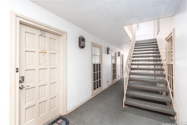 entrance to property featuring stucco siding