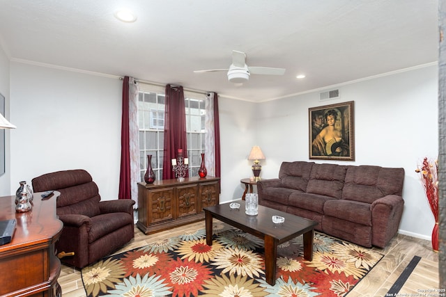 living room with a ceiling fan, crown molding, and light wood finished floors