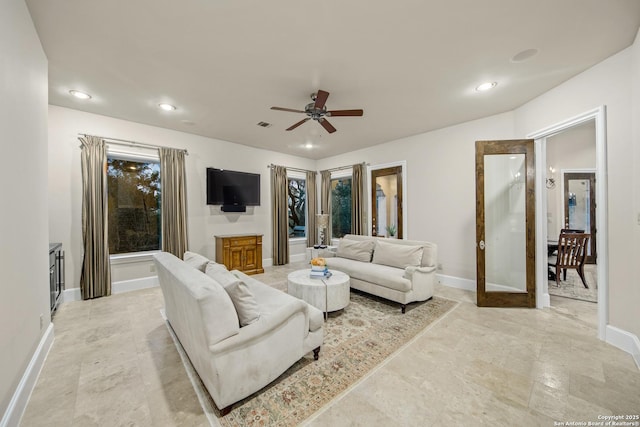 living area with ceiling fan, recessed lighting, visible vents, and baseboards