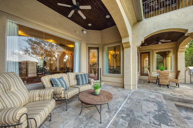 view of patio featuring ceiling fan and outdoor lounge area