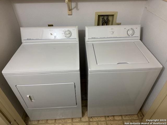 laundry area featuring laundry area and independent washer and dryer