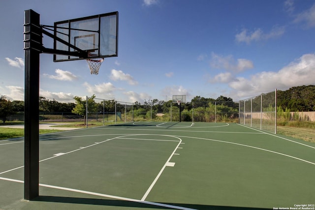 view of sport court with community basketball court and fence