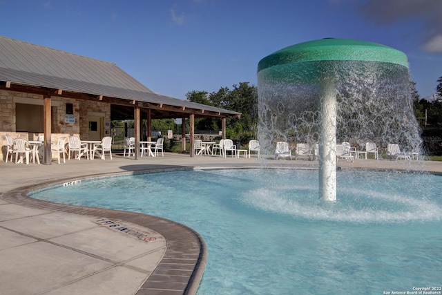 pool with a patio