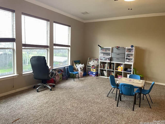 carpeted home office featuring visible vents, crown molding, and baseboards