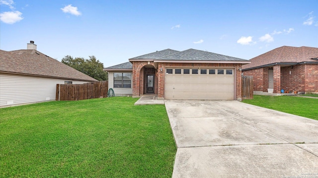 ranch-style home with brick siding, concrete driveway, a front yard, fence, and a garage