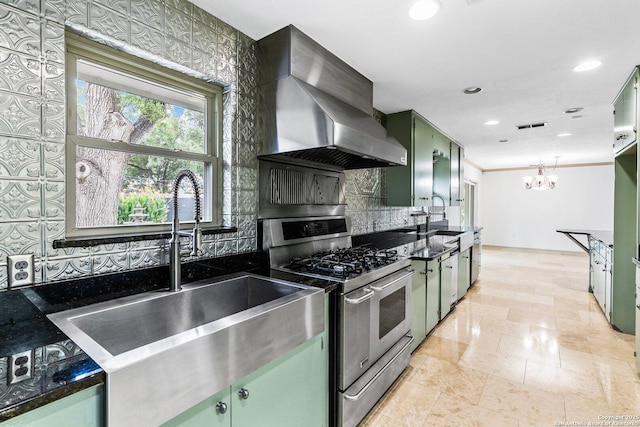 kitchen featuring green cabinetry, dark countertops, exhaust hood, and double oven range