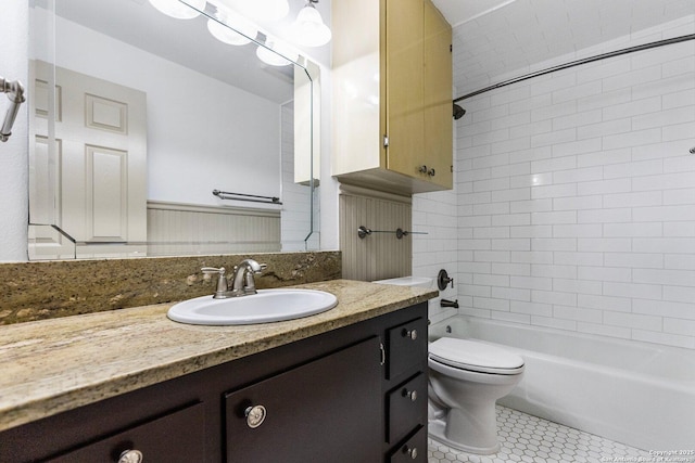 full bathroom with tub / shower combination, vanity, toilet, and tile patterned floors