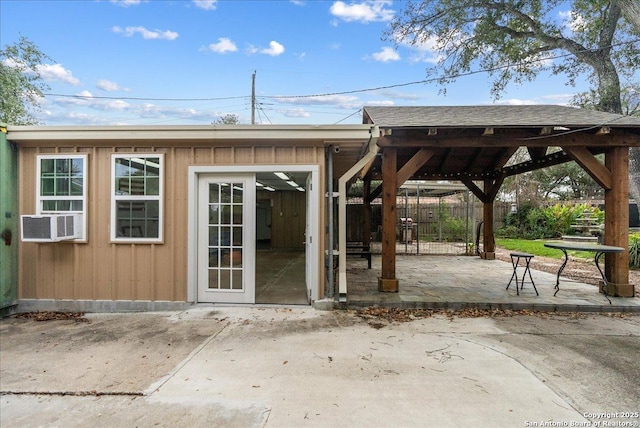 exterior space featuring cooling unit and fence