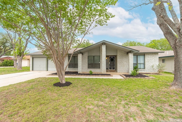 mid-century home featuring stone siding, a front lawn, driveway, and a garage