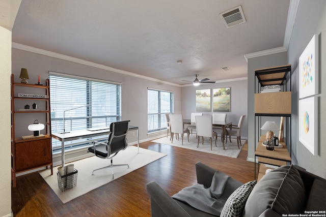 living room featuring a ceiling fan, crown molding, wood finished floors, and visible vents
