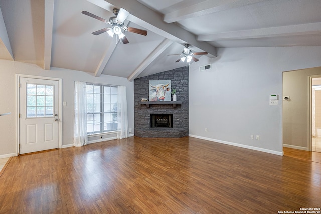 unfurnished living room with wood finished floors, visible vents, and a ceiling fan