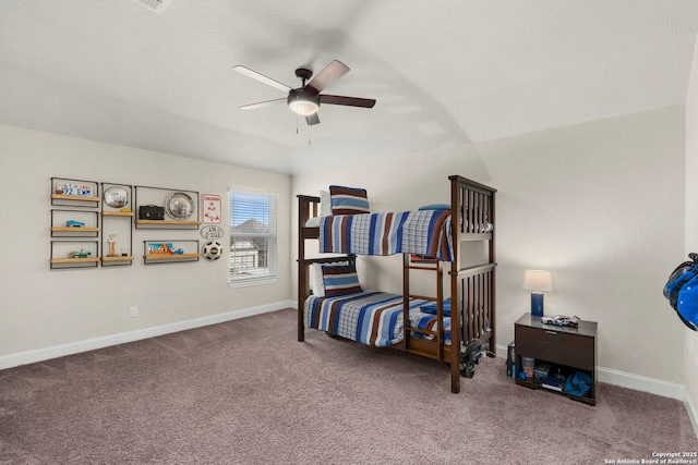 bedroom with ceiling fan, carpet flooring, and baseboards