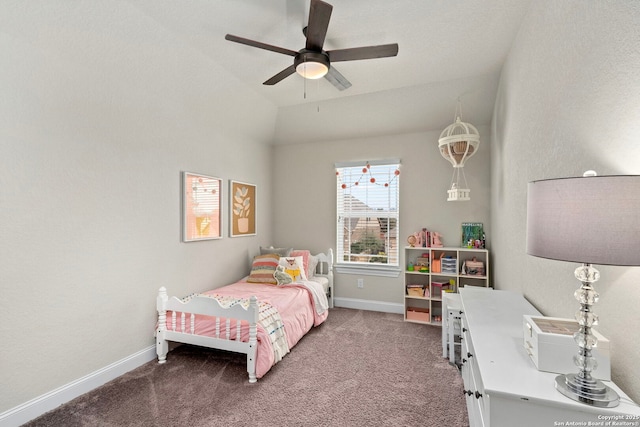 carpeted bedroom featuring ceiling fan, lofted ceiling, and baseboards