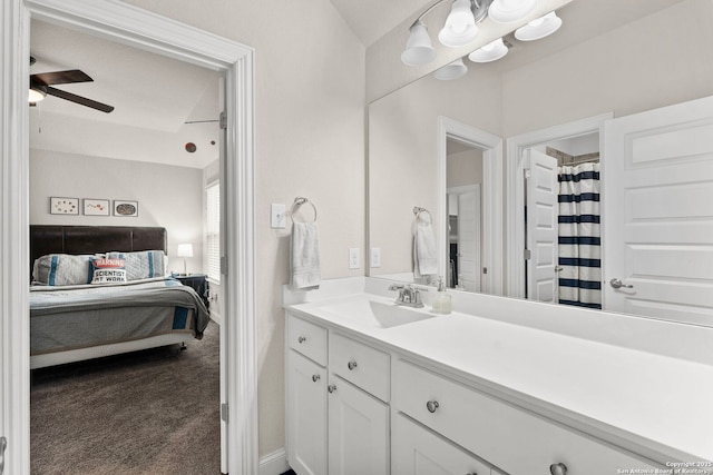 ensuite bathroom with ceiling fan, ensuite bath, and vanity