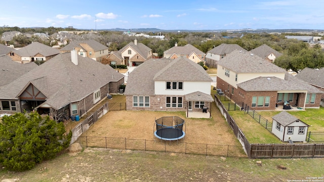 birds eye view of property with a residential view