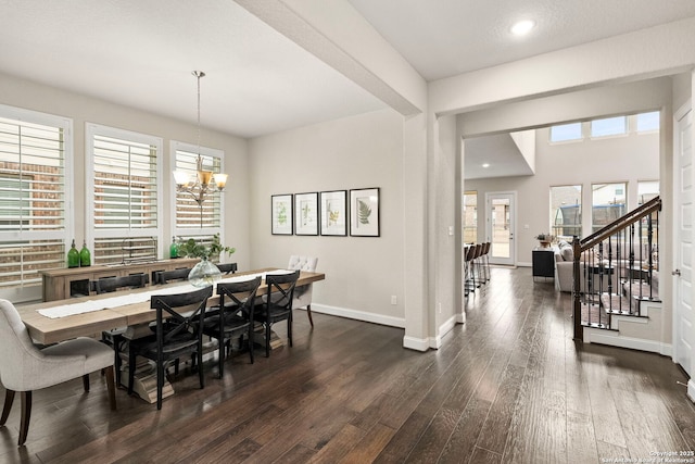 dining area featuring dark wood finished floors, recessed lighting, stairway, a chandelier, and baseboards