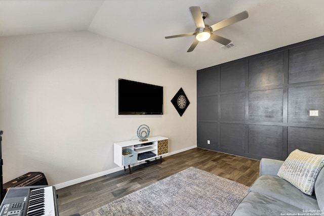 living room featuring baseboards, visible vents, a ceiling fan, dark wood-style flooring, and vaulted ceiling