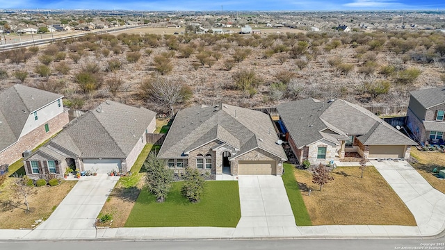 birds eye view of property with a residential view