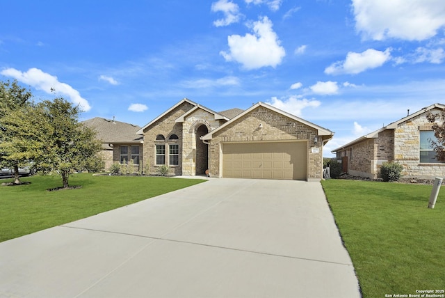 view of front of home featuring an attached garage, driveway, brick siding, and a front yard