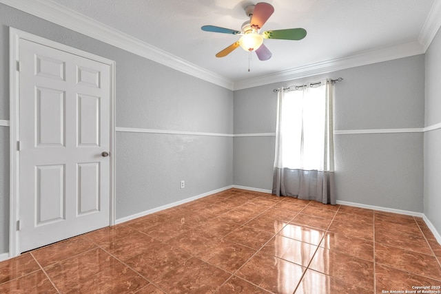 unfurnished room featuring baseboards, a textured wall, dark tile patterned flooring, ceiling fan, and crown molding