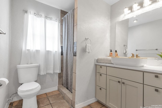 full bath featuring toilet, tile patterned floors, a shower stall, and vanity