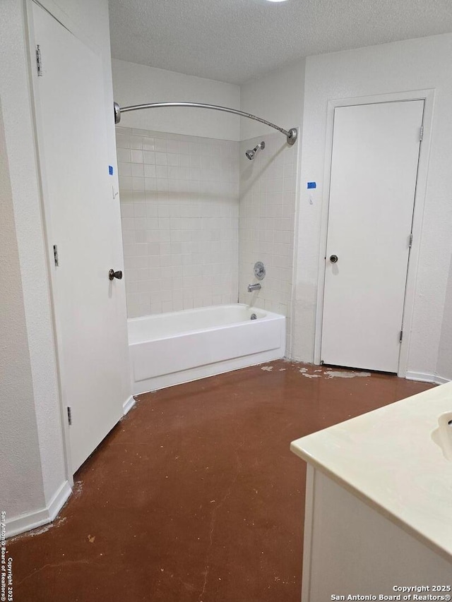 bathroom with carpet, a textured ceiling, vanity, concrete floors, and shower / washtub combination