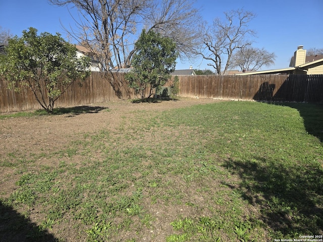 view of yard featuring fence