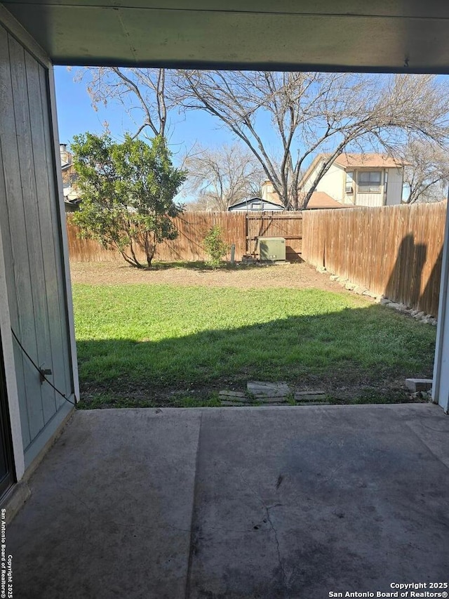 view of yard with a patio area and a fenced backyard