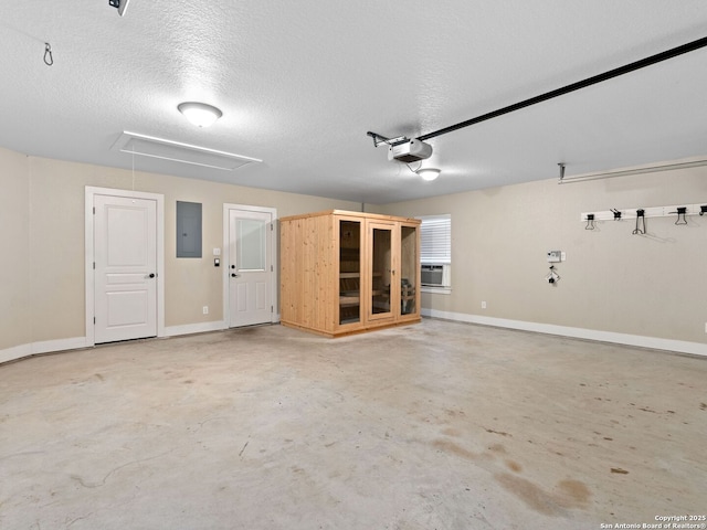 garage featuring a garage door opener, cooling unit, electric panel, and baseboards