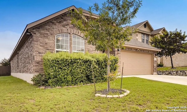 view of front of house with a front yard, driveway, and an attached garage