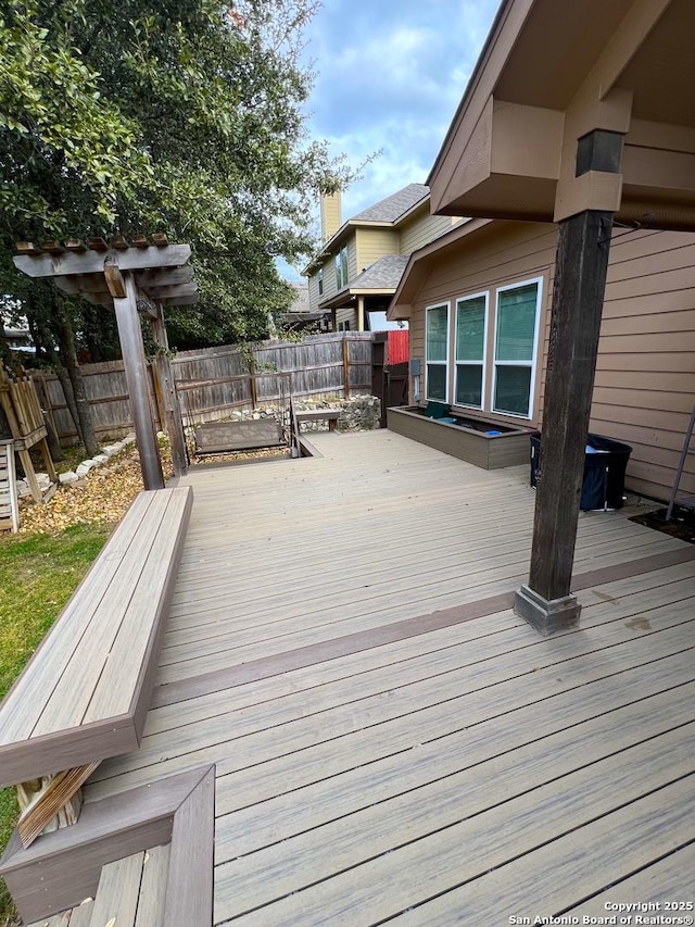 wooden deck featuring fence