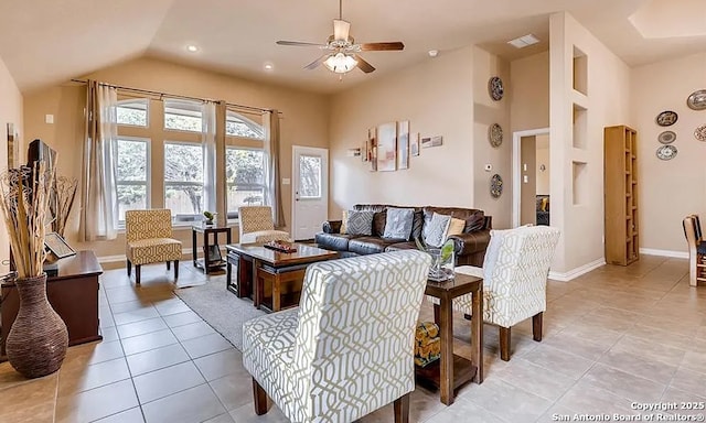 living area featuring light tile patterned floors, high vaulted ceiling, visible vents, a ceiling fan, and baseboards