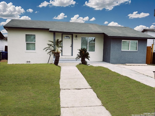 ranch-style house with a front lawn and brick siding