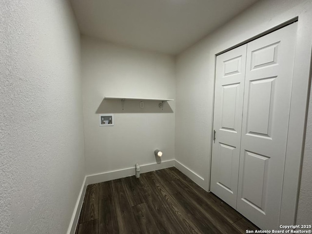 laundry room featuring laundry area, dark wood-type flooring, washer hookup, and baseboards