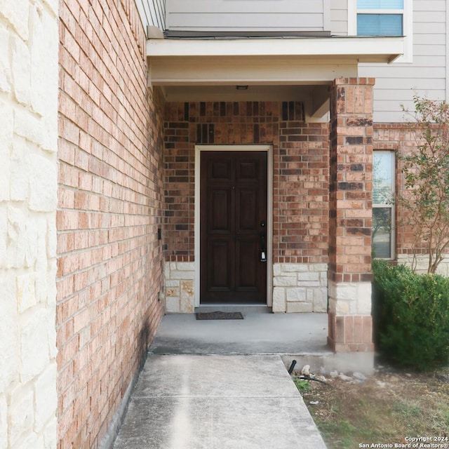 11830 Bricewood Pass, San Antonio, TX 78254 - doorway to property featuring stone siding and brick siding