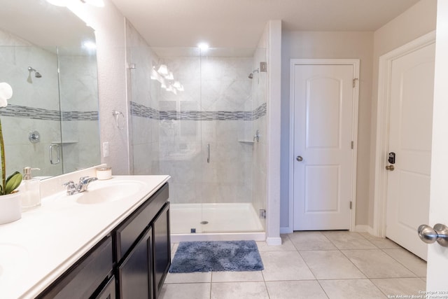11830 Bricewood Pass, San Antonio, TX 78254 - full bath featuring double vanity, a stall shower, tile patterned flooring, and a sink