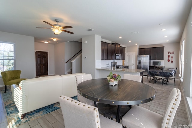 11830 Bricewood Pass, San Antonio, TX 78254 - dining room featuring visible vents, a ceiling fan, light wood-style flooring, stairway, and recessed lighting