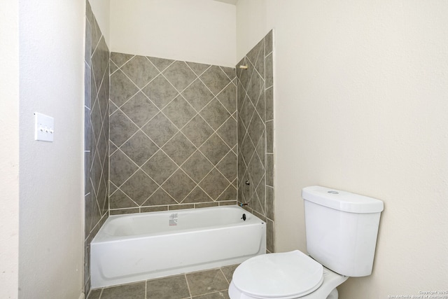 full bath with toilet, tile patterned flooring, and tub / shower combination