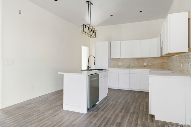 kitchen with dishwasher, light countertops, a sink, and white cabinetry