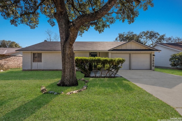 ranch-style house with board and batten siding, a front lawn, driveway, and a garage