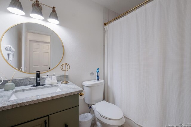 full bath featuring toilet and vanity