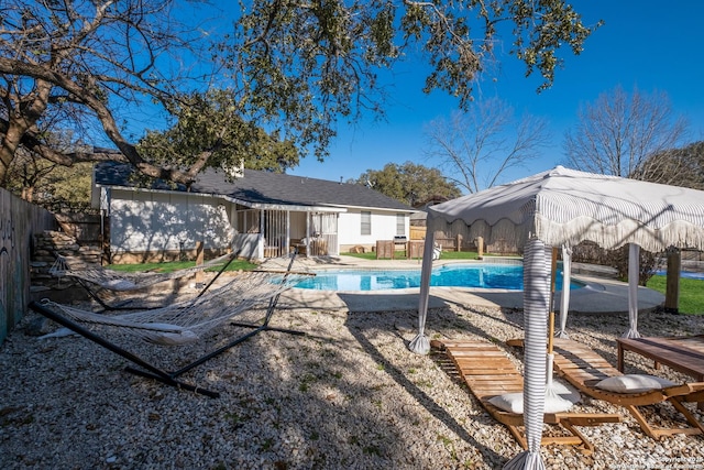 view of swimming pool with fence and a fenced in pool