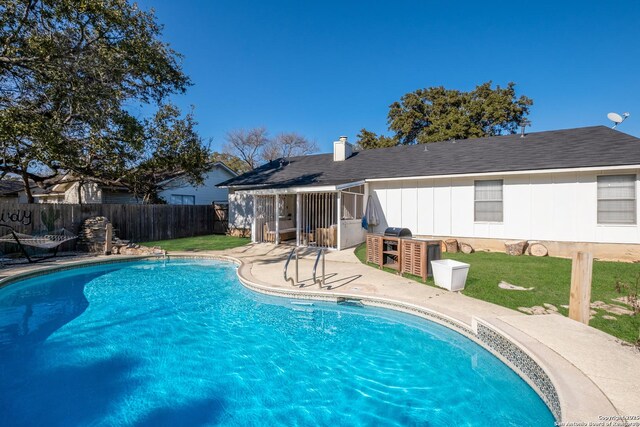 view of pool with a patio area, fence, and a fenced in pool