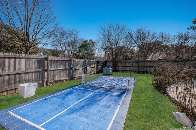exterior space featuring a fenced backyard and a lawn