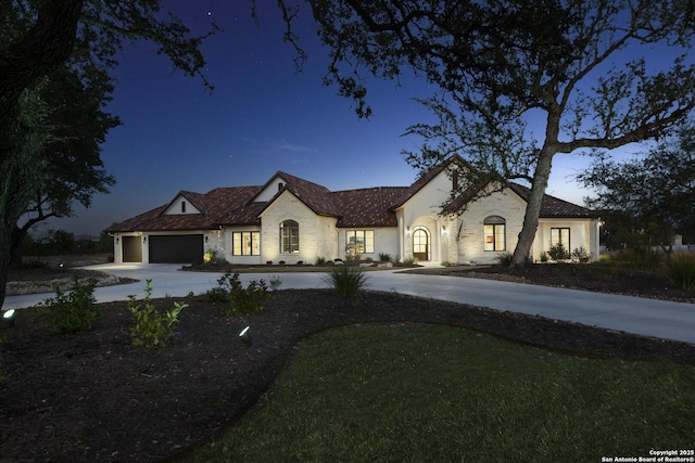 view of front facade featuring a garage and concrete driveway