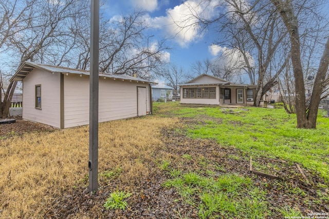 view of yard with a sunroom