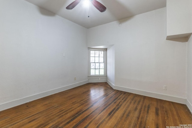 unfurnished room with ceiling fan, baseboards, and dark wood-style flooring