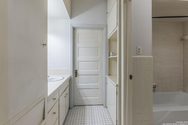 bathroom with tile patterned floors and vanity