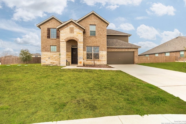 view of front of property featuring driveway, brick siding, a front yard, and fence